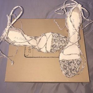 Lace up snakeskin pumps