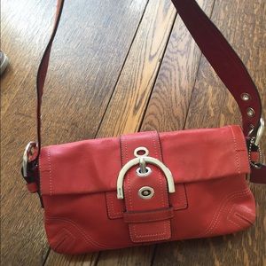 Small orange Coach Bag.