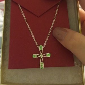beautiful cross necklace with green gems