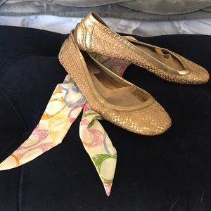 Classic gold and tan Coach ballet flats