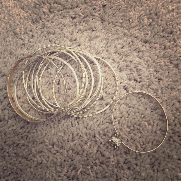 Gold tribal bracelets & an elephant bracelet