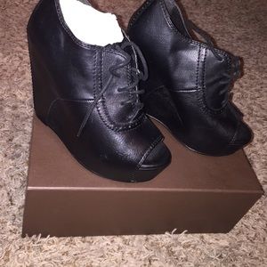 Worn once. Black leather wedges. Steve Madden
