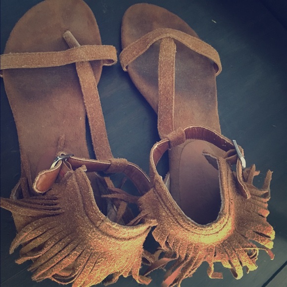 Fringed suede sandals.