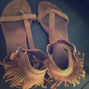 Fringed suede sandals.
