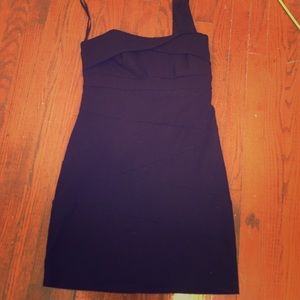 One shoulder black dress.