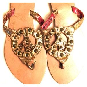Not Rated gold peace sign sandals. Size 6.