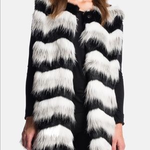 1. State chevron black, white, grey faux fur vest