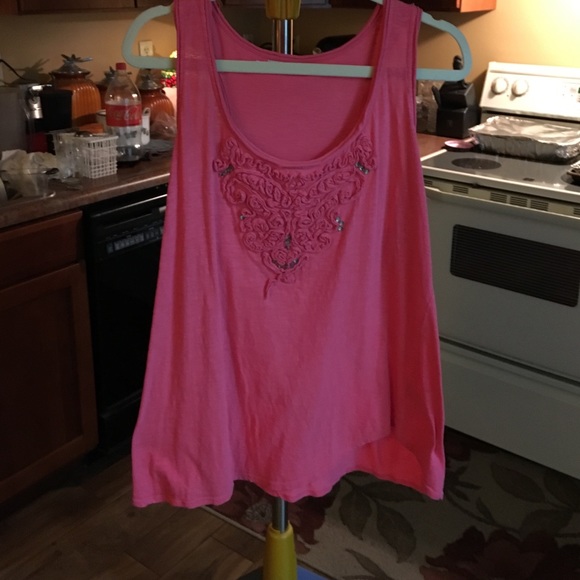 pinkish-salmon colored tank.
