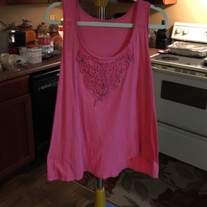 pinkish-salmon colored tank.