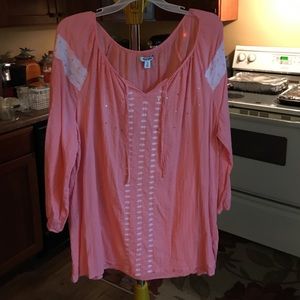 a peach blouse.
