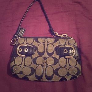Black and grey Coach wristlet