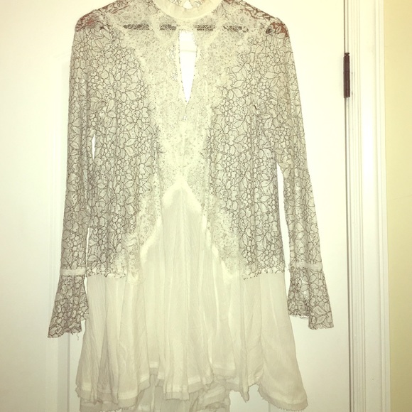 Sexy white top with black lace detail.