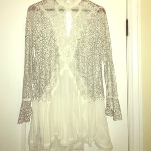 Sexy white top with black lace detail.