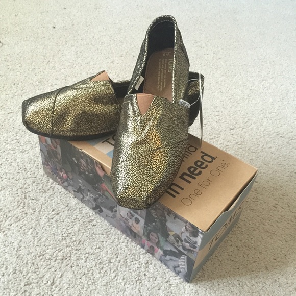 NIB gold Neiman Marcus exclusive Toms size 9