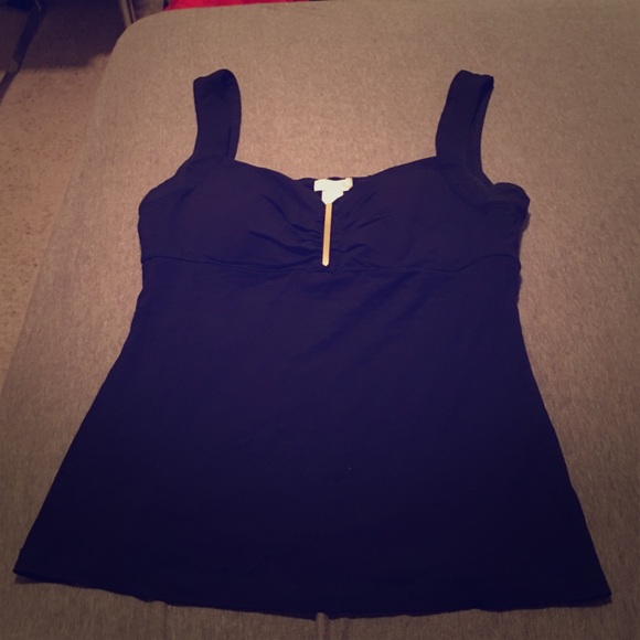 Size medium black & gold Caché tank. Gently used