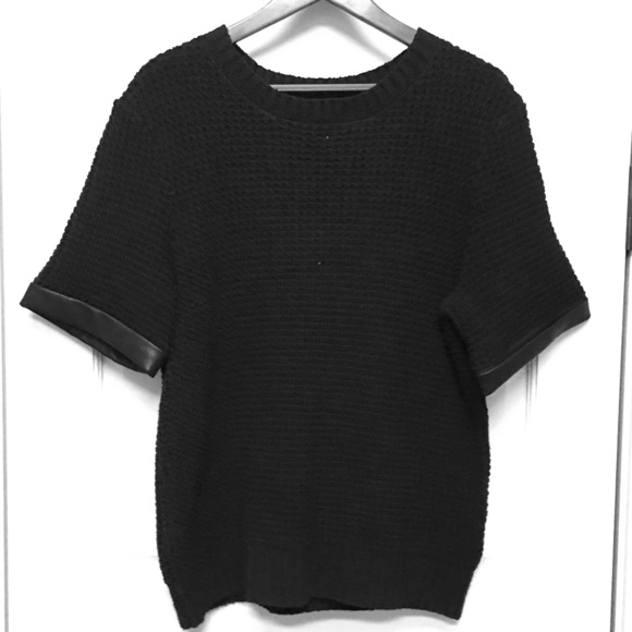 Sweater with black leather trim on sleeve