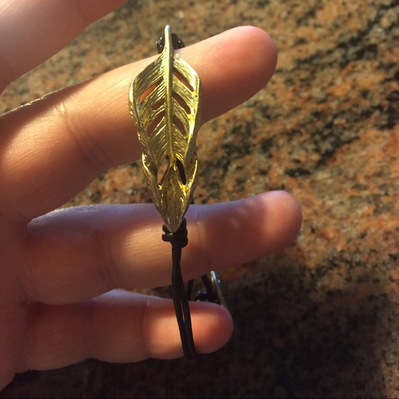 Gold plated feather bracelet with leather band