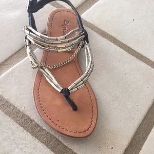 Gold and black flats