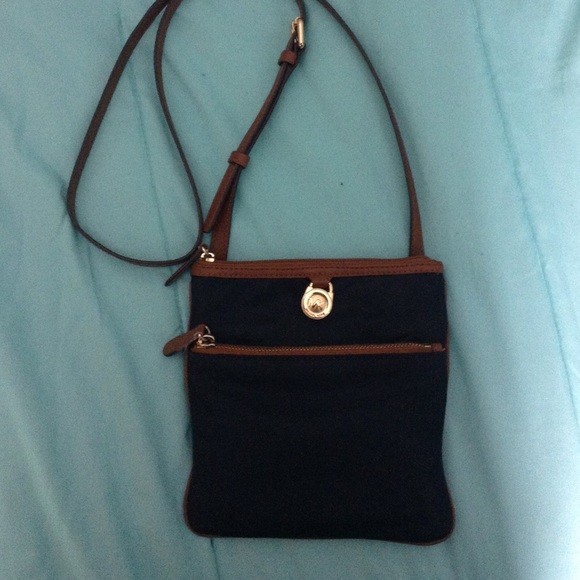 Navy blue Michael Kors cross body. Gently used
