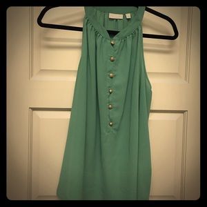 Sleeveless top with gold buttons