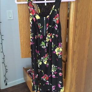 A black floral patterned sun dress
