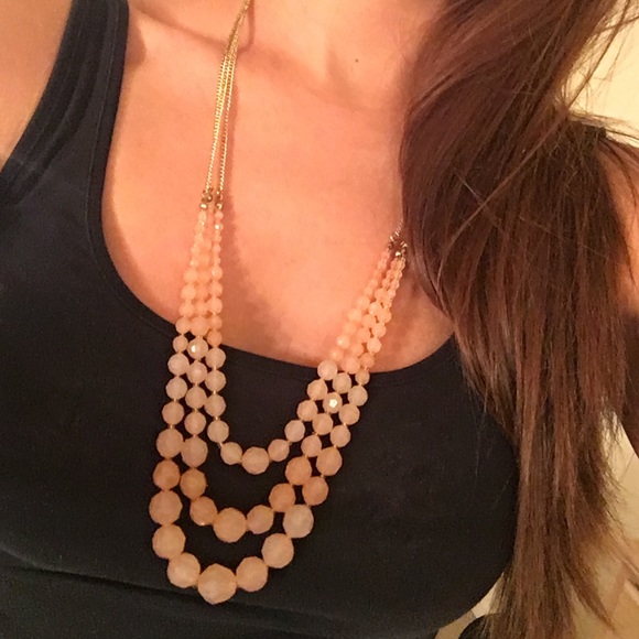Light pink, layered necklace with gold chain