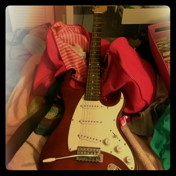 J. Reynolds full sized red electric guitar