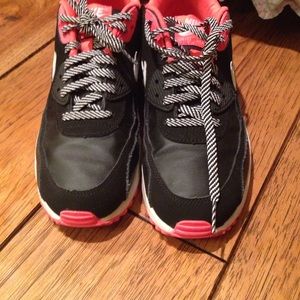 Pink and black nike air shoes