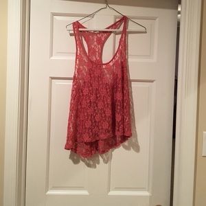 Flowery see through tank top. In great condition.