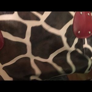 Two for the price of one! Two cow print purses!