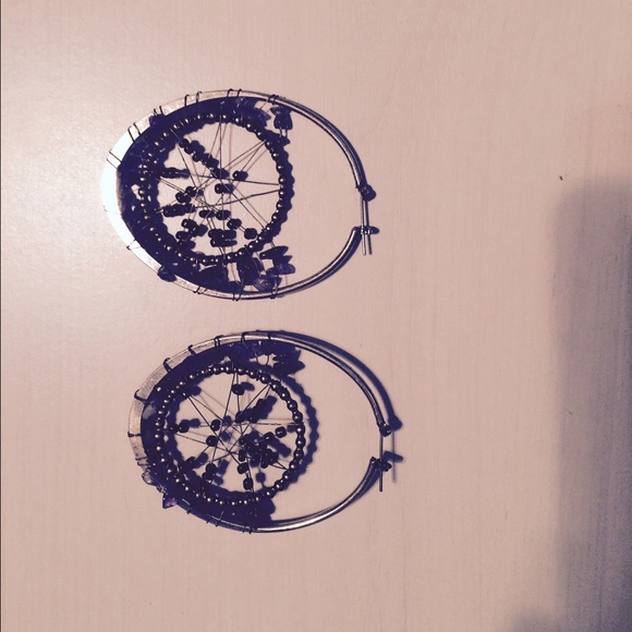 Silver hoop earrings with intricate details