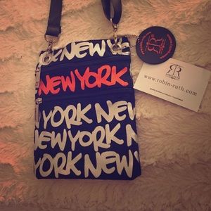 NEW YORK printed cross body bag.