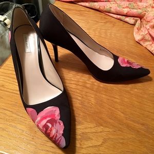 Cole Haan black floral pumps.
