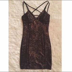 Metallic gold and black strappy back dress