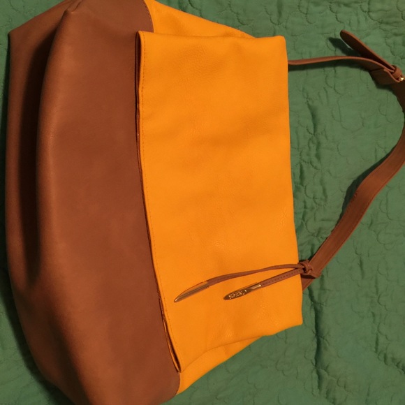 Carlos Santana yellow handbag never used