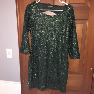 Green sparkly backless long sleeve dress.