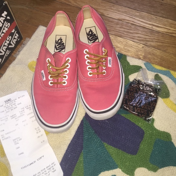 coral vans with leather laces.