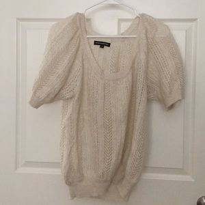 Light cream short sleeve sweater blouse.
