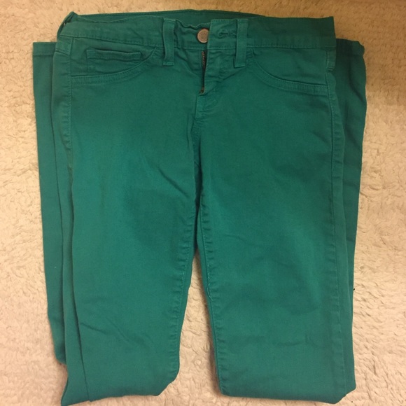 Green colored skinny jeans