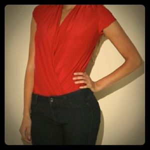 Arden B. Red bodysuit.