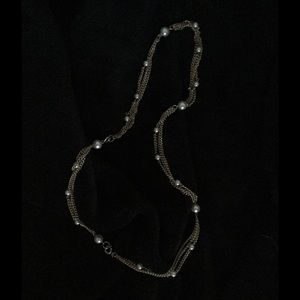 Vintage necklace with pearl insert between chain.