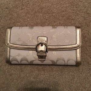 Gold and white COACH wallet