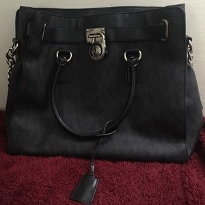 Authentic Michael Kors bag, black, medium sized.