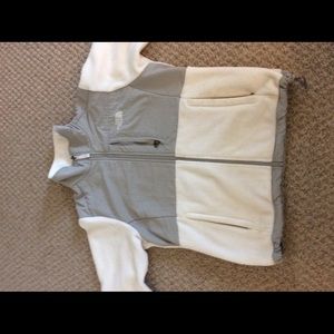 White and grey fleece North Face jacket