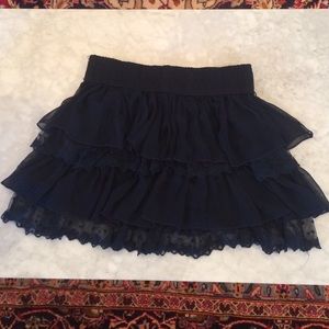 Navy blue lace and sheer ruffled miniskirt