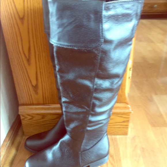 Brand new tall black boots.
