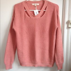 Women's blush pink sweater with collar cut-out