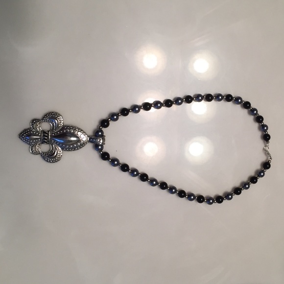 Black and silver Fleur-de-lis necklace .