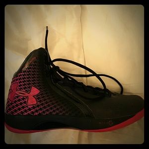 Woman's UNDER ARMOR basketball shoes.