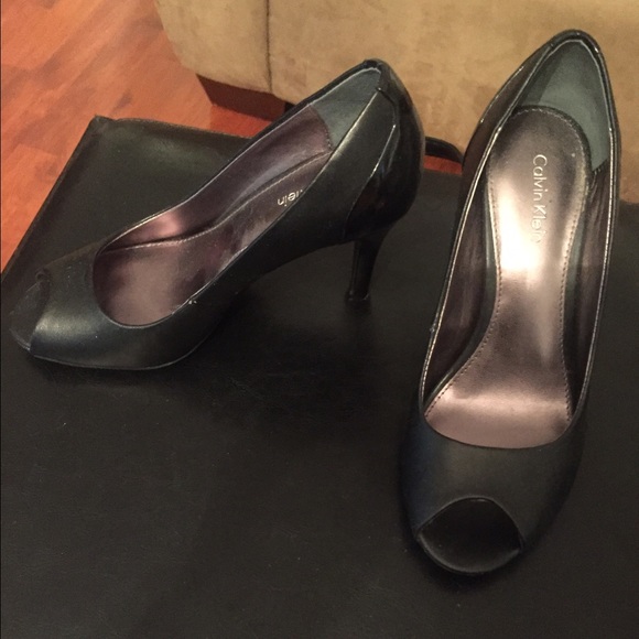 Black Calvin Klein peep toe heels.